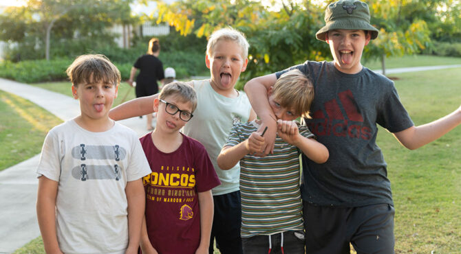 neighbourhood friends standing together pulling a funny face in rockhampton