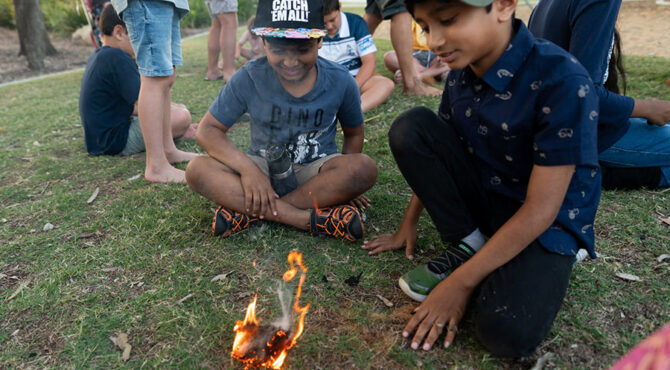 two boys with hats on at community event in rockhampton